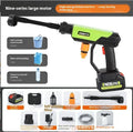 Green wireless high-pressure water gun with multiple nozzle attachments on a garden patio.