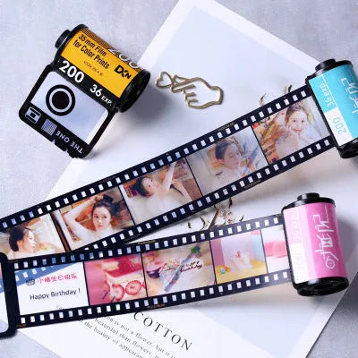 Kodak yellow wooden memory colour film album boxes stacked with a tote bag