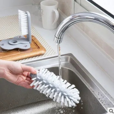 Grey rotating cup brush with suction cups for wall mounting and double cleaning heads