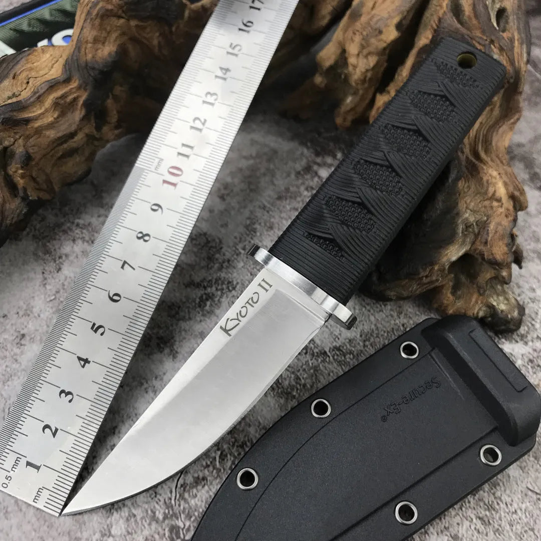 Mini straight knife with 440C steel blade, ABS handle, and holster on outdoor surface