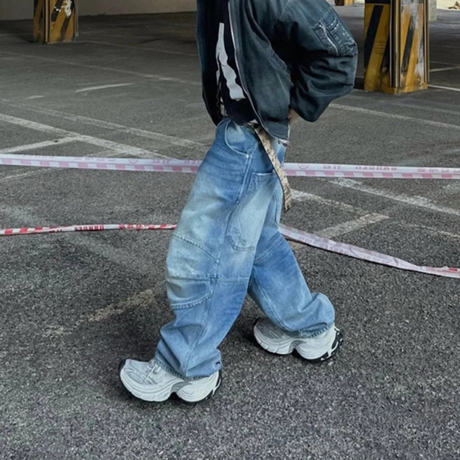 Men's washed white blue baggy jeans with pleated detailing and straight-leg style
