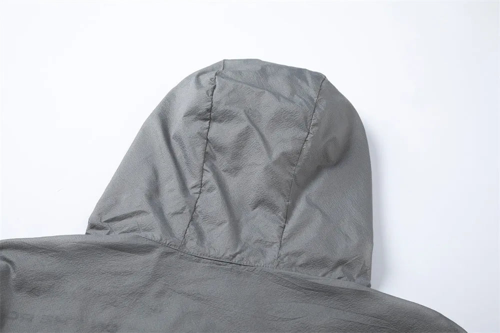 Men's lightweight nylon sun protection jacket with letter print, available in grey or black, sizes M to XXL