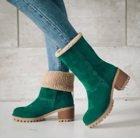 Women's black suede mid-tube snow boots with a thick heel and round toe on a waterproof platform.