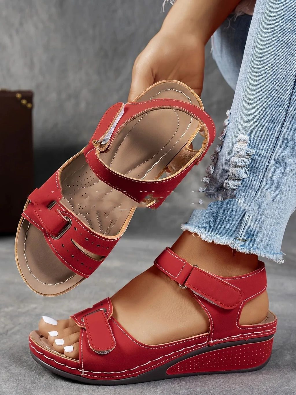 Women's beige strap sandals with thick composite sole and adjustable Velcro fastener on a white background.
