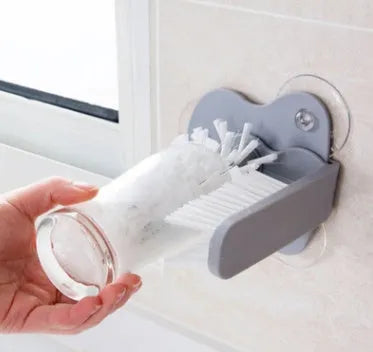 Grey rotating cup brush with suction cups for wall mounting and double cleaning heads