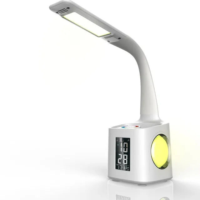 White 7-in-1 LED desk lamp with USB port, LCD screen, calendar, pen holder and colour night light base