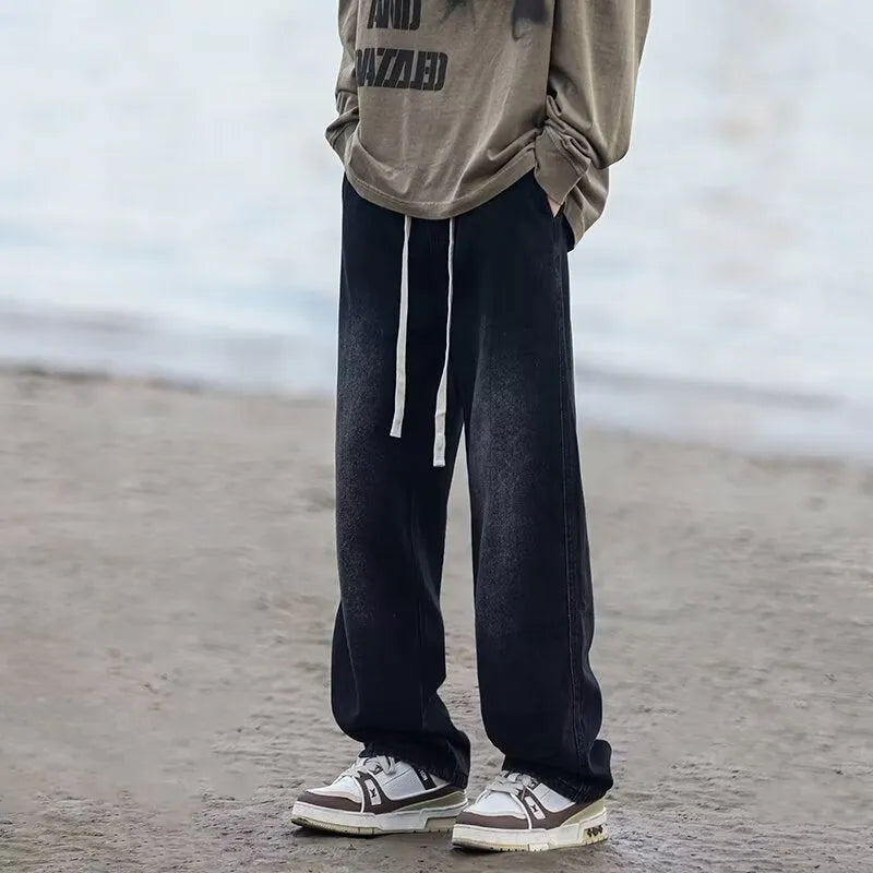 Men's straight-leg cotton jeans trousers in loose fit with drawstring waist