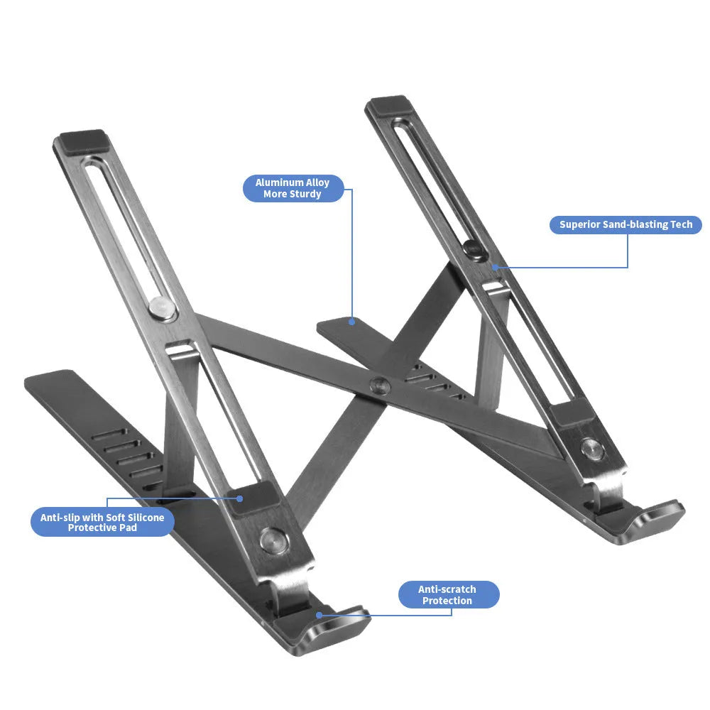 Silver aluminium laptop stand folded flat next to an open laptop, showing its six-angle adjustment hinge.