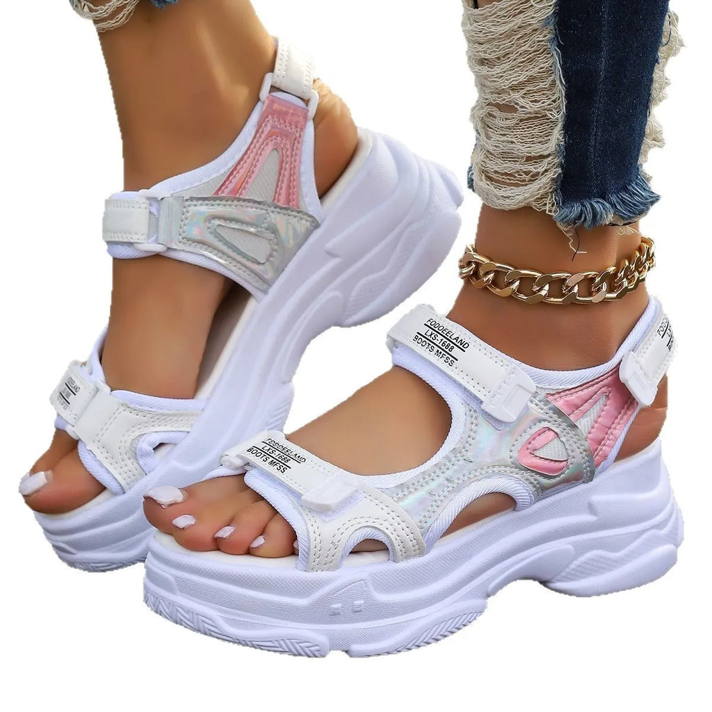 Women's black Roman platform sandals with secure strap design on white background