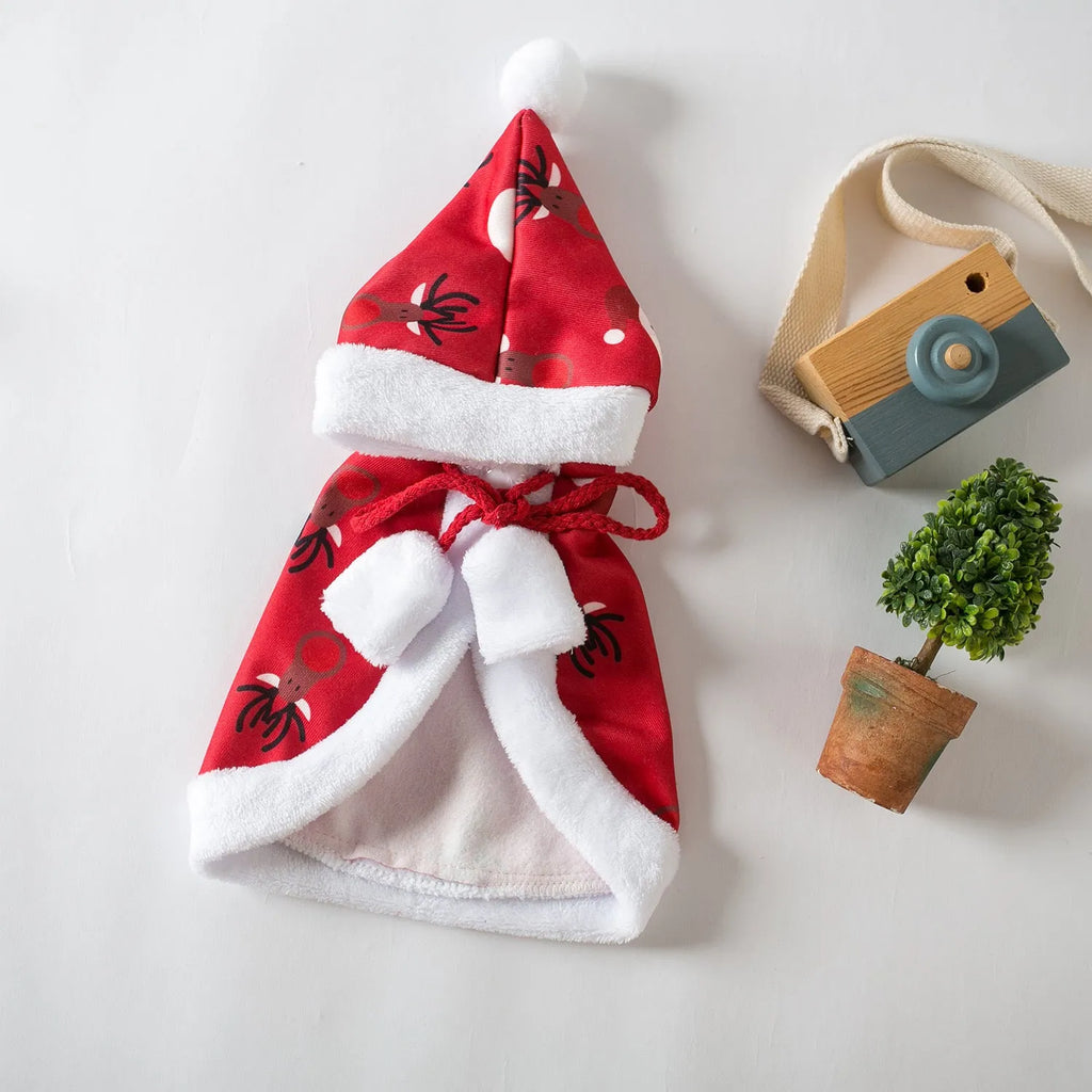 Red deer-print Christmas cloak cape on a cat, showing Little Red Riding Hood style.