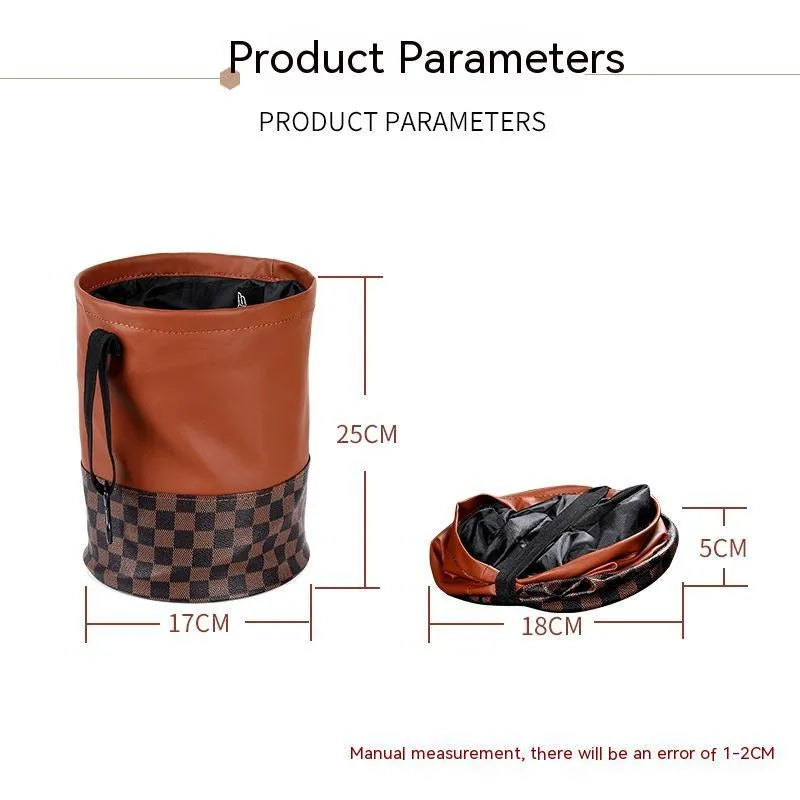 Brown leather retractable car trash can shown in a folded state with a carry handle.
