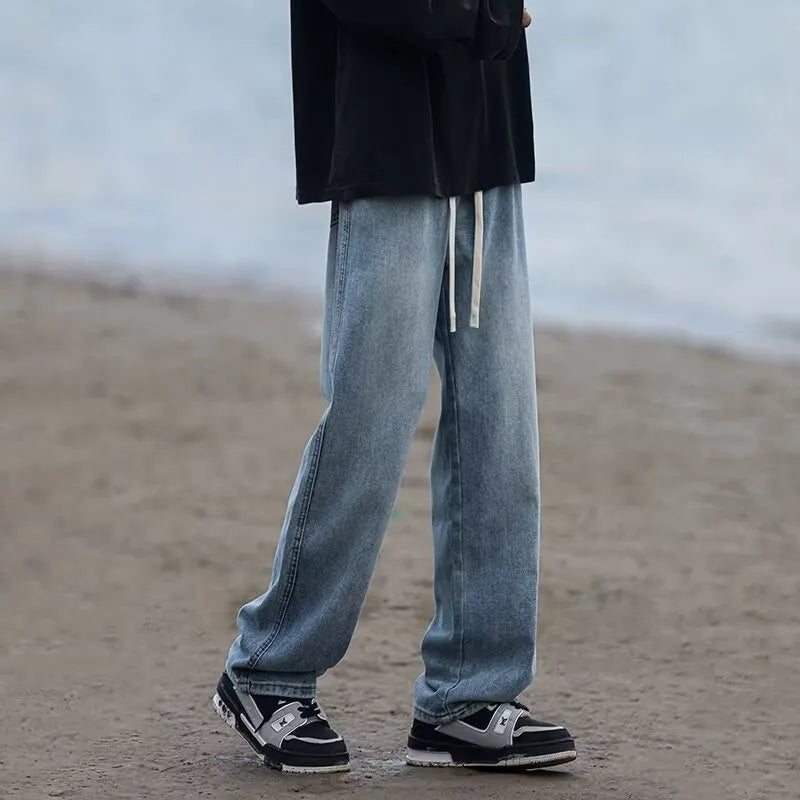 Men's straight-leg cotton jeans trousers in loose fit with drawstring waist
