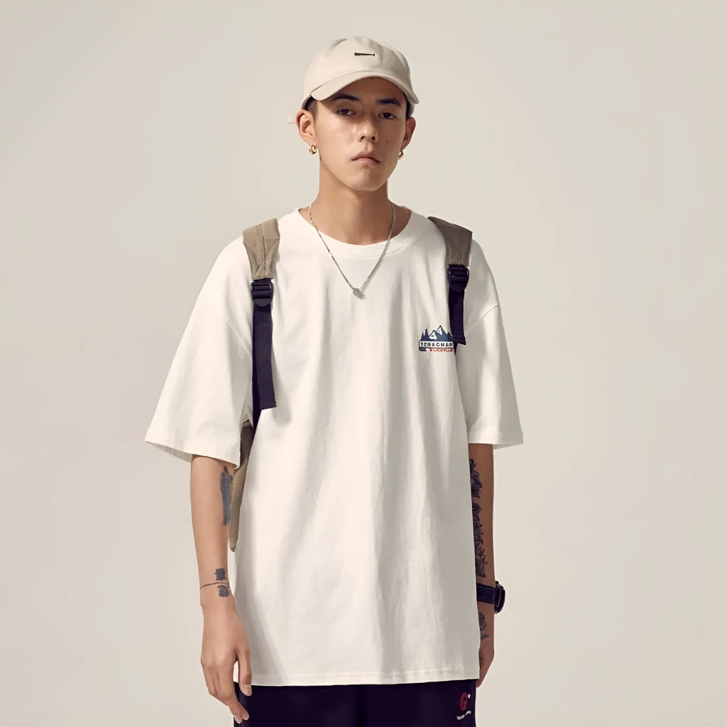 Men's black plus size loose fit short-sleeved t-shirt on a hanger