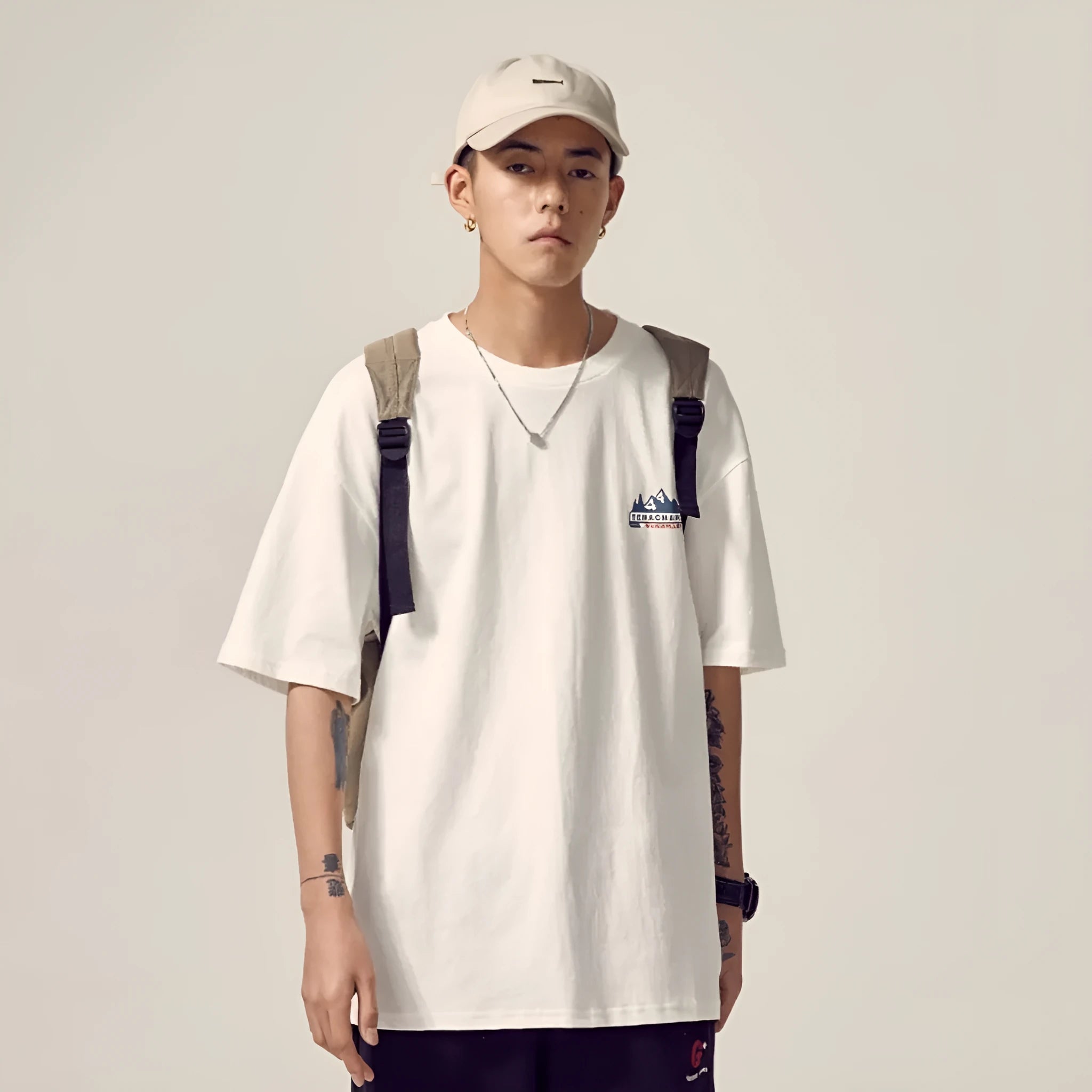 Men's black plus size loose fit short-sleeved t-shirt on a hanger