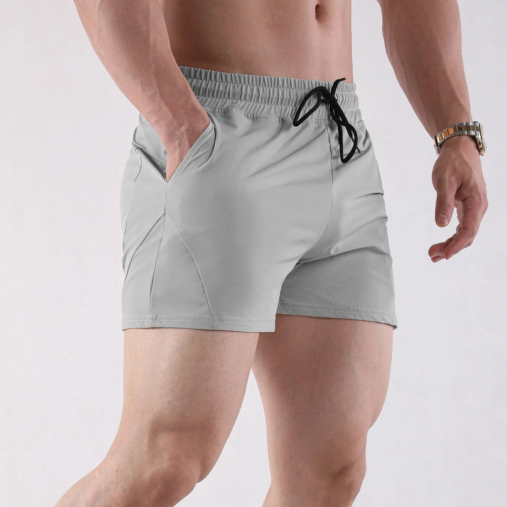 Men's thin grey polyester basketball shorts with elastic waistband, shown front view.