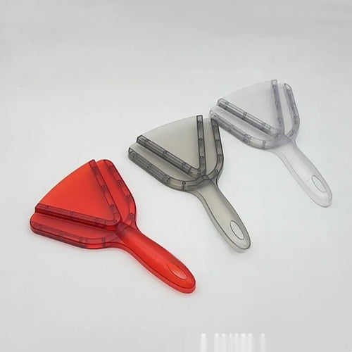 Adjustable telescopic bottle and can opener with a non-slip red handle on a kitchen counter.