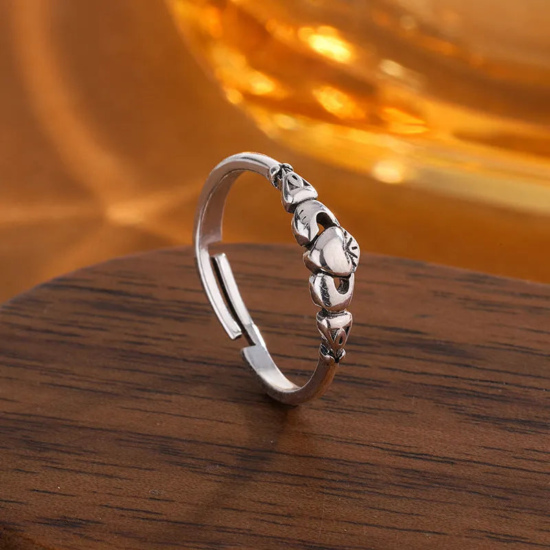 Women's copper heart open ring with retro silver finish showing adjustable back design