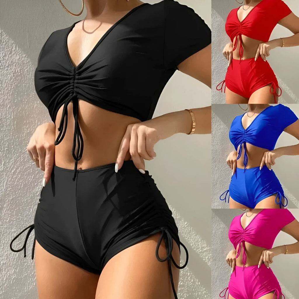 Women's dark green lace-up swimsuit top with matching shorts on a mannequin.