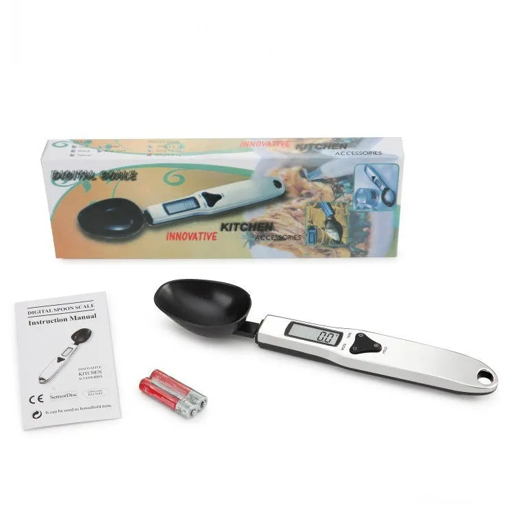 Digital measuring spoon with electronic display showing weight measurement in grams