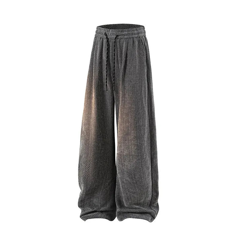 Light grey straight-leg hollow-out trousers with an elastic waistband, shown laid flat.