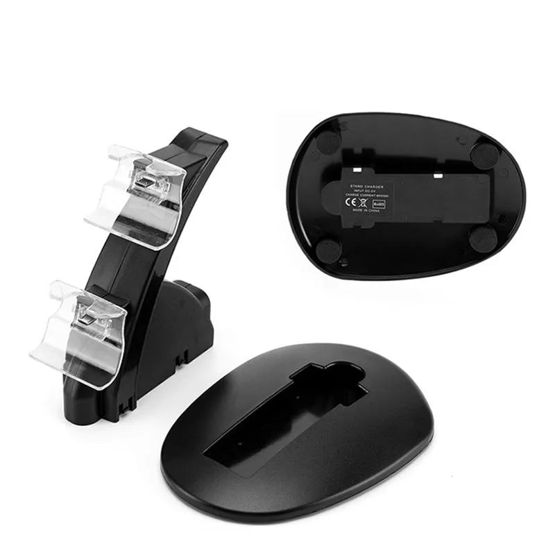 Black dual charging stand holding two Xbox One controllers upright.