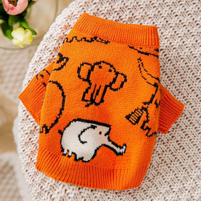 Small dog wearing a blue winter knitted sweater with charming patterns, soft polyacrylic material, side view