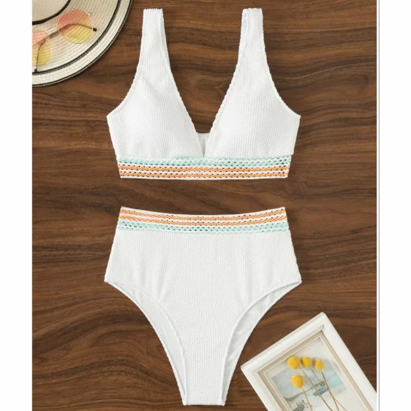 A pink high-waisted bikini set for women on a white background, showing the sleeveless top and briefs.