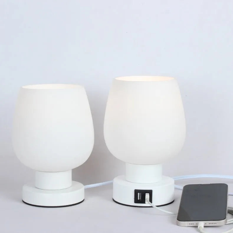 Nordic touch glass desk lamp with three colour modes and USB power on a bedside table