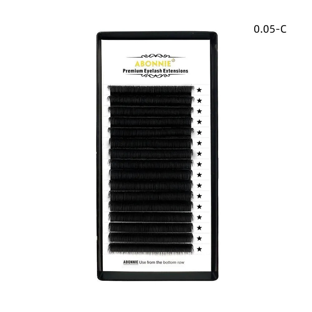 Close-up of 16-row dense mink hair false eyelashes on a matte round wool band.