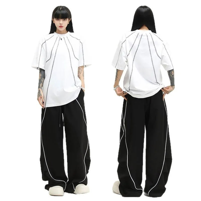 Black pleated wide-leg hip hop sports trousers with striped pattern on a mid waist.