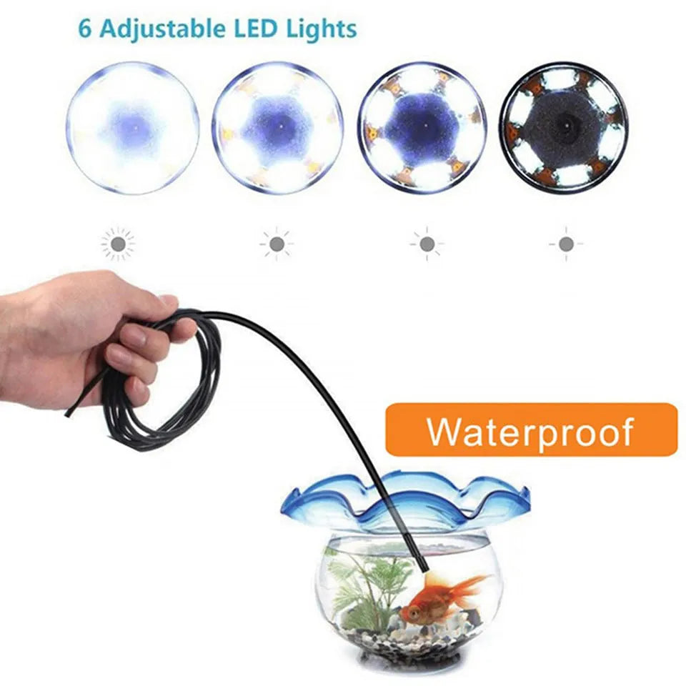 USB-C endoscope with small camera probe, magnet, hook, and side mirror attachments on a table.