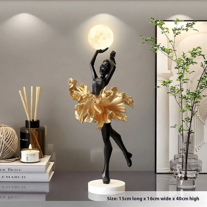 Small modern resin night light ornament with USB cable in black gold colour.
