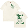 Loose fit linen t-shirt featuring a cartoon print of 'Rise And Grind' text with a green coffee expression bag.