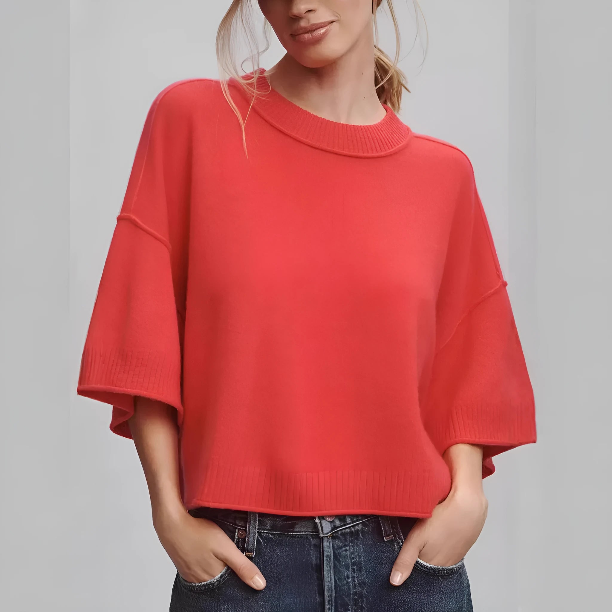 Red cropped women's t-shirt with regular sleeves and exposed navel styling on mannequin