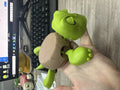 Set of four turtle shell design coasters in light green, dark green, wheat starch, and yellow colours.
