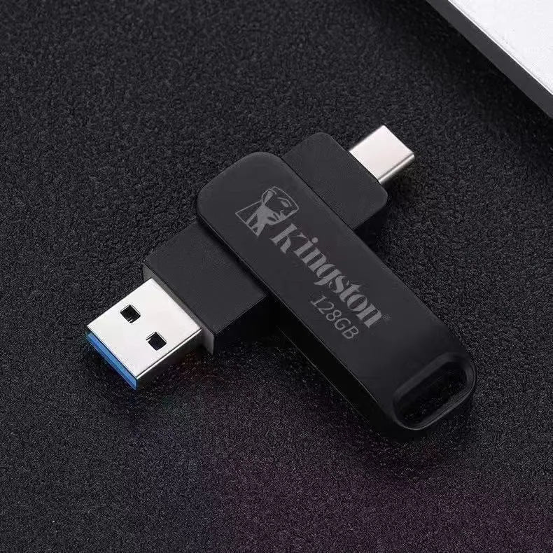 Rotating metal USB flash drive showing USB and USB-C connectors with black finish and protective iron box packaging