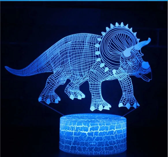 Colourful dinosaur 3D LED night light with remote control on a desk