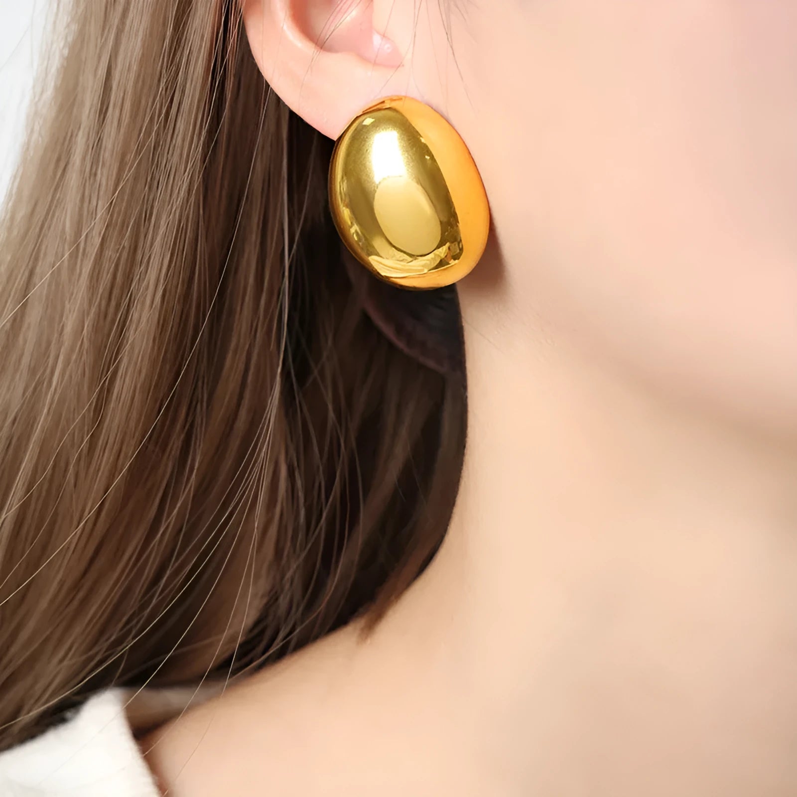 Geometric ear studs with electroplated 18K gold finish and line pattern detailing