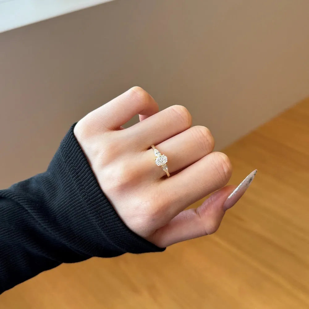 S925 sterling silver ring with three main stones in drop shape, gold or white gold colour, sizes 5 to 9