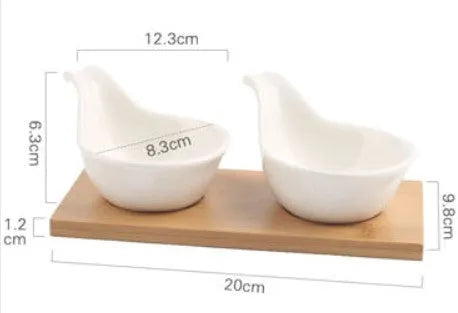 Porcelain ceramic dried fruit dish with compartments on wooden serving board
