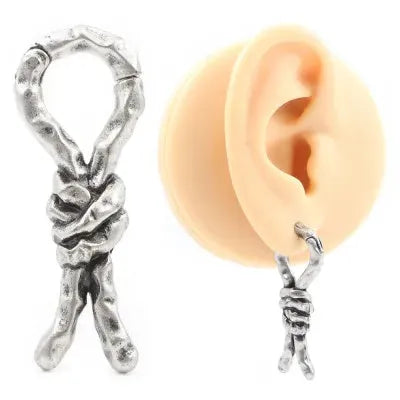 Close-up of a single 4mm copper piercing earring with a retro bending and connecting shape.
