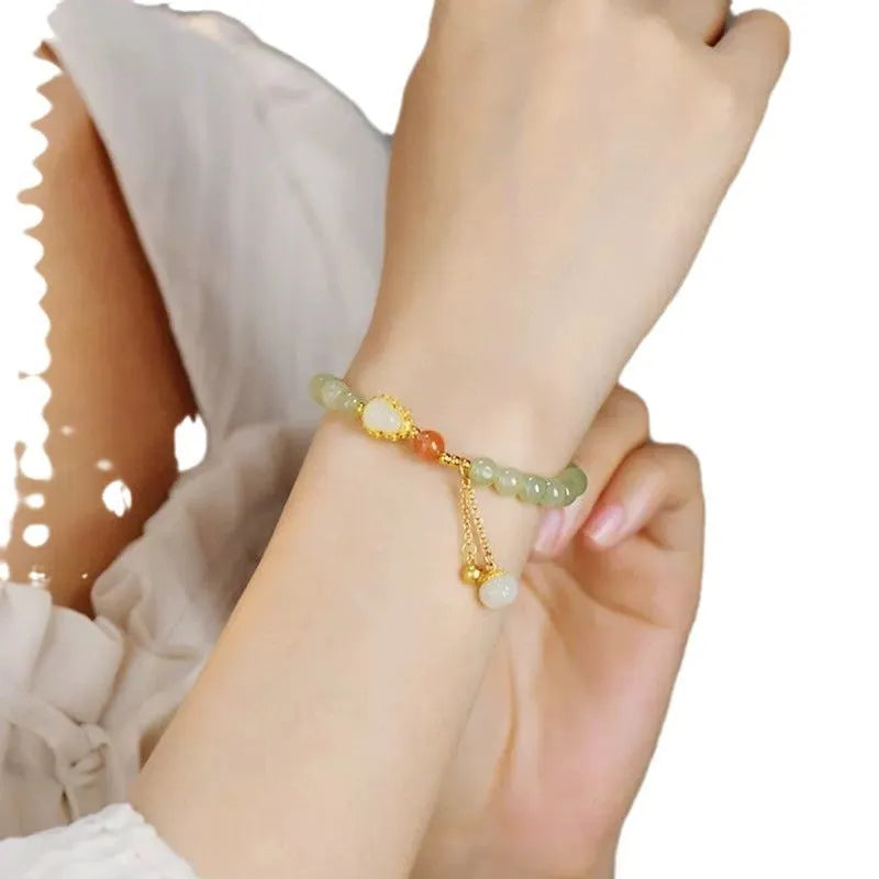 Qingshui jade women's bracelet with gold gourd design and fu character symbol