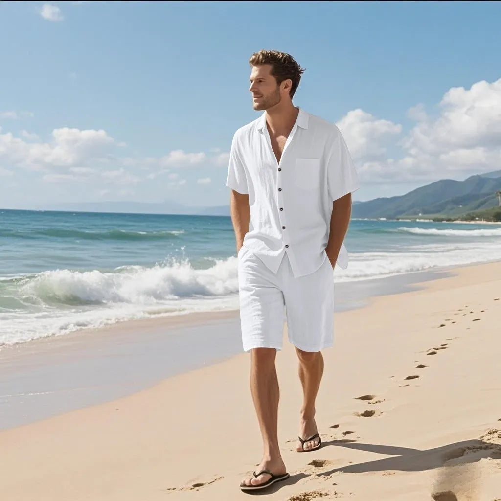 Linen blend short sleeve shirt and matching shorts beach suit set laid flat, shown in light blue colour.