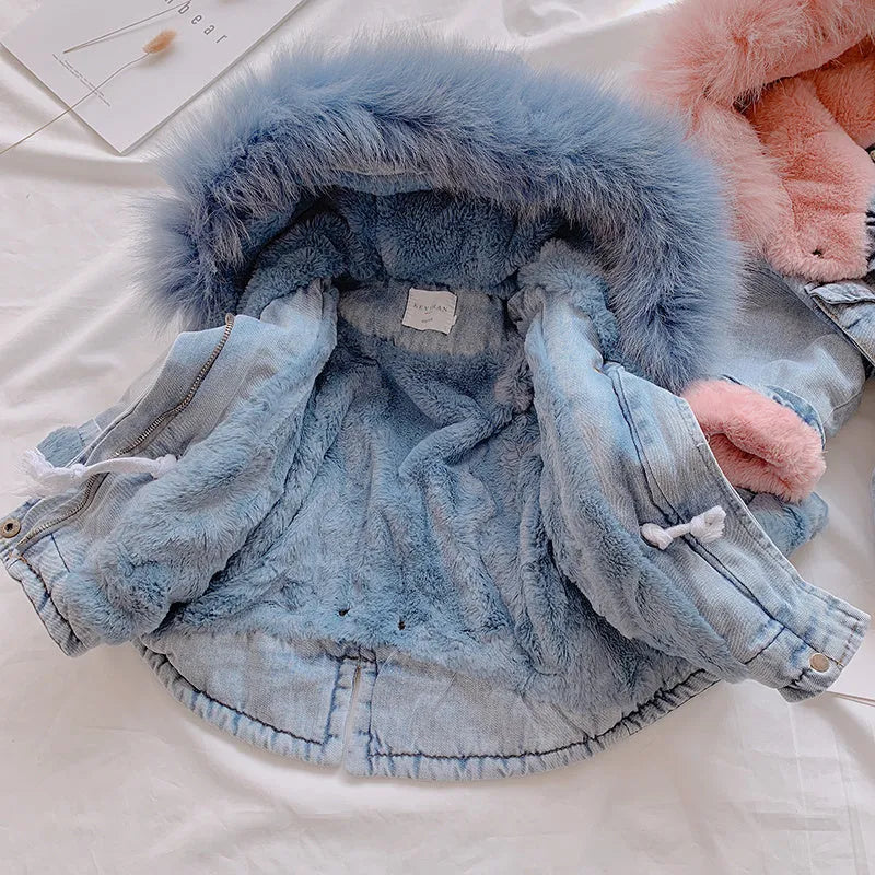 Blue denim jacket for girls with a fleece lining and attached hood.