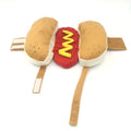 Red and yellow hot dog costume for small dog on white background