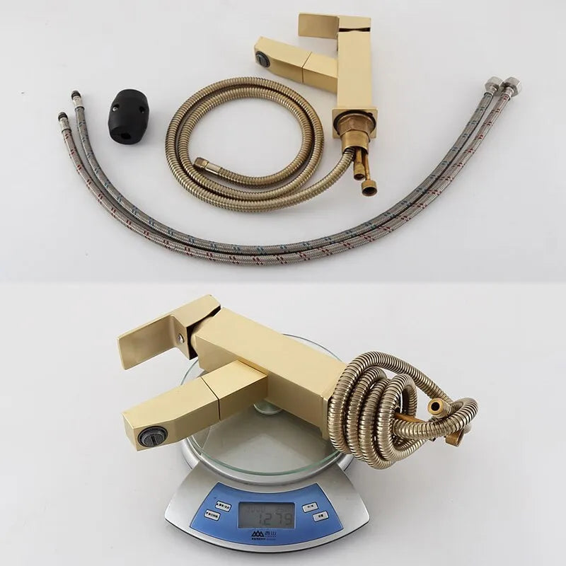 Square pull-action faucet in brushed gold finish for kitchen or bathroom sink.