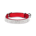 Red velvet cat collar with rhinestones on a white background, showing buckle and adjustable strap.
