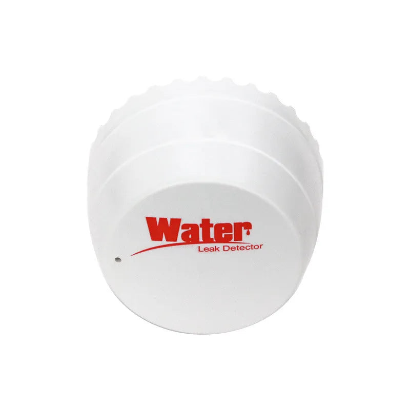 White WiFi smart leakage alarm with buzzer placed on a floor for water overflow detection