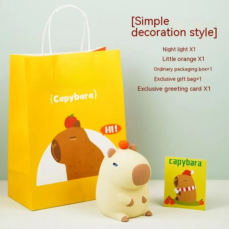 Capybara-shaped silicone night lamp with USB charging port and compact dimensions