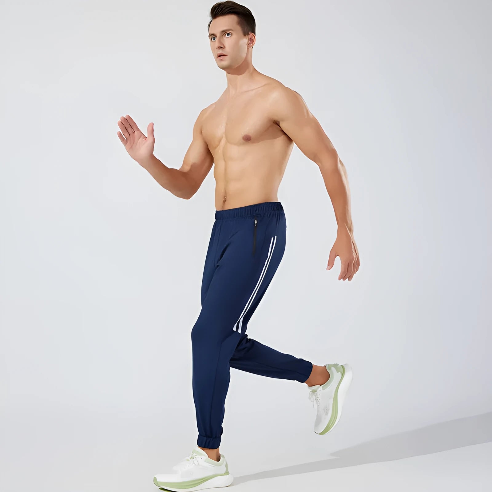 Men's black polyester running trousers with a mid waist and full-length legs.